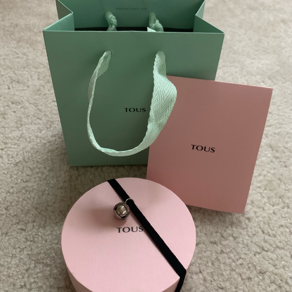 Empty Tous box with bag